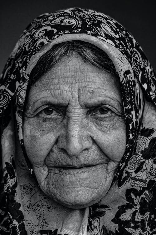 closeup portrait of an old lady with wrinkles